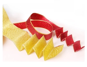 Detail of red and gold glitter ribbon with wired edges for flexible DIY bow styling