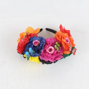 Top view of Mexican floral headband with colorful roses and butterfly ornaments