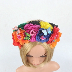 Detailed view of colorful Mexican floral headband with artificial butterflies for festivals