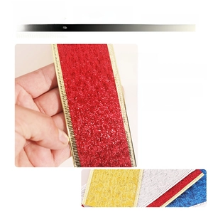 Detail of glittered decorative ribbon with metallic edges and textured finish for DIY gifts