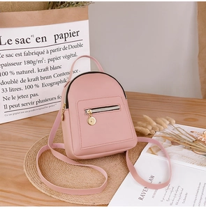 Pink mini backpack purse with multiple pockets and stylish lychee grain texture leather