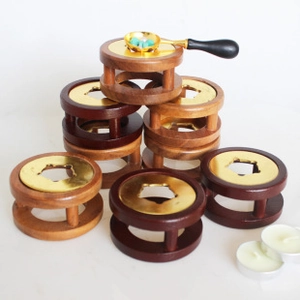 Solid wood wax seal furnace with metal warmer plates in mahogany and natural finishes