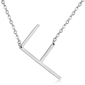 Detailed close-up of a silver-tone metal F-letter pendant on a sleek chain necklace