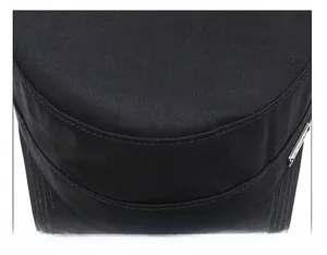 Detail of a black cotton military cap showing premium stitching and metal logo plate
