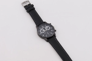 Detail of Geneva black leather watch strap with contrast white stitching and buckle