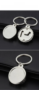 Detailed view of a silver bottle opener keychain with a polished mirror finish on dark leather