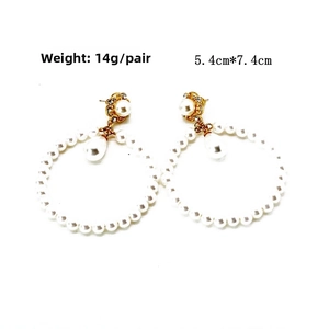 Detail view of pearl hoop earrings with gold floral studs, size 5.4cm by 7.4cm, weight 14g