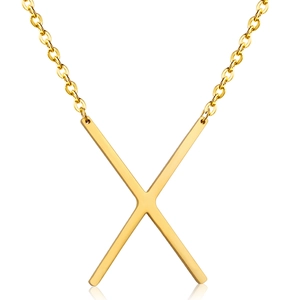 Detailed view of a polished 18K gold plated stainless steel letter X pendant necklace