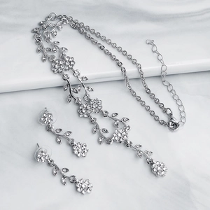 Elegant floral necklace and earrings set with silver finish and clear crystals