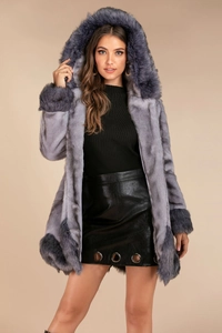 Detailed view of plush purple faux fur coat featuring a hood and soft hairy texture