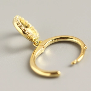 Gold s925 silver hoop earrings with geometric pave diamond pendants in a minimalist style
