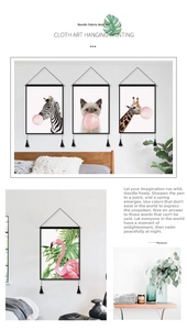 Detail of Nordic canvas wall art with animal patterns, slim black frame, and tassels