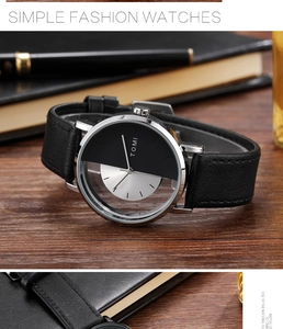 Close-up of TOMI hollow design watch with black leather strap and split silver dial