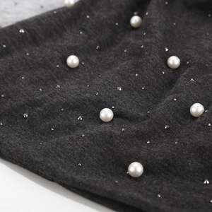 Dark grey cotton beanie featuring elegant white pearls and sparkling rhinestone accents