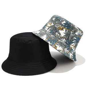 Reversible tropical palm tree print and solid black cotton canvas bucket hat set