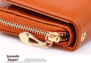 Macro shot of smooth metal zipper and premium oil leather texture on women's wallet