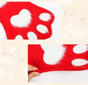 Close-up of thick felt texture and dog paw pattern on festive Christmas stocking