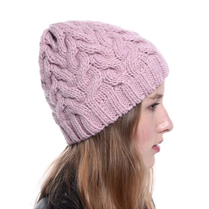 Detail of pink cable knit headband showing thick soft acrylic texture and ribbed edges