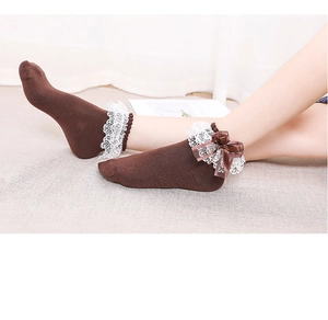 Detailed view of brown Lolita ankle socks with white lace trim and ribbon bow
