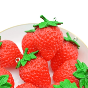 Realistic PVC strawberry pendant keychain accessory with detailed texture and green leaves