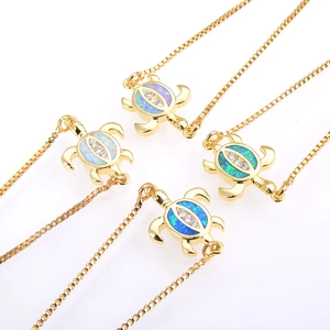 Gold plated turtle opal bracelets with cubic zirconia accents for women on white background