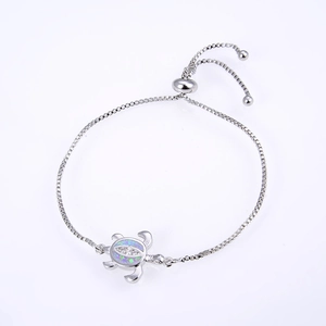 Detailed view of turtle bracelet with opal shell and sparkling cubic zirconia stones