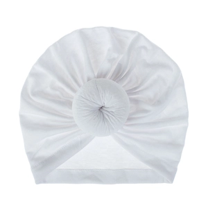 Detailed view of white donut knot turban hat with soft elastic breathable fabric.