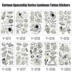 Luminous space tattoos for boys featuring astronauts, rockets, and UFOs in 10 styles