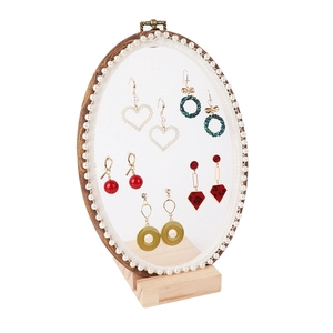 Elegant oval lace jewelry display rack with pearl edge and solid wood base stand