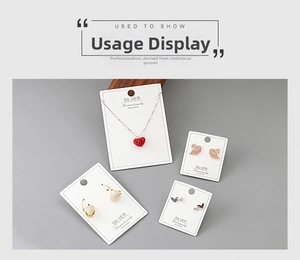 Collection of S925 silver jewelry featuring heart pendants and swan earrings on cards