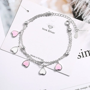 Double-layered silver bracelet with pink heart charms and round beads for women