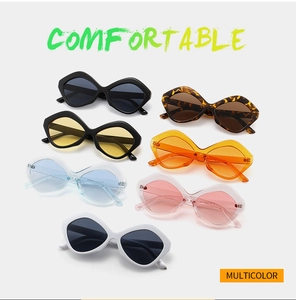 Flat lay view of multicolor geometric butterfly sunglasses with polished frames and metal hinges