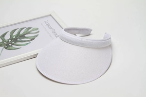 Close-up of white breathable mesh sun visor with an open top design for sun protection
