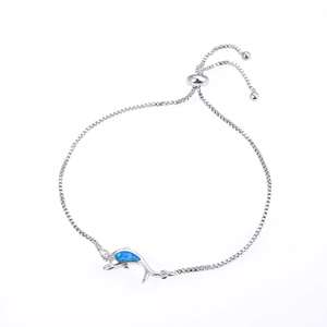 Silver dolphin bracelet with blue opal stone and adjustable box chain on white background
