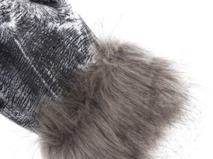 Close-up of werewolf paw gloves with black speckled texture and fluffy grey faux fur trim
