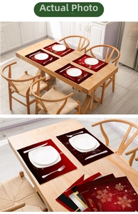 Detailed view of red Christmas placemats with gold reindeer and snowflake prints
