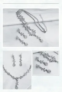 Detailed view of silver floral necklace and earring set with sparkling crystals
