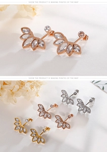 Detailed view of floral zircon stud earrings in rose gold, gold, and silver finishes