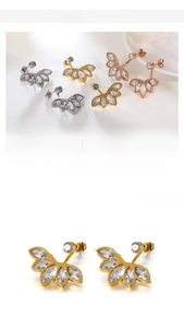 Detailed view of leaf-shaped stainless steel earrings in gold, silver, and rose gold finishes