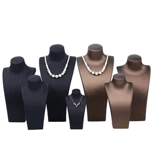 Professional portrait necklace displays in black brushed leather and bronze metal finishes