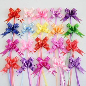Close-up of 18mm colorful gift pull bows with gold edges and various printed patterns