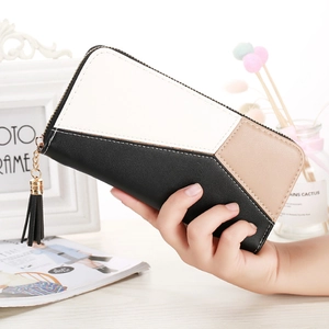 Close-up of tricolor patchwork long wallet with PU leather and black tassel zipper pull