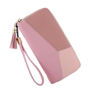 Detail of pink patchwork leather wallet with gold zipper and tassel wristlet strap