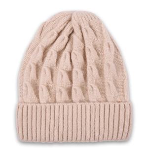 Close-up of beige knitted beanie showing thick cable stitch texture and ribbed cuff