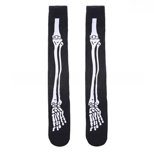 Macro detail of high-elastic black thigh high socks with white human skeletal prints