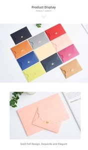 Close-up of mini pearlized envelopes with scalloped edges and gold heart foil accents