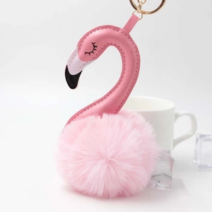 Pink flamingo keychain featuring a soft faux fur pompom and stylish faux leather neck