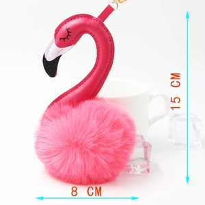 Pink flamingo plush keychain showing 15 cm height and 8 cm width dimensions