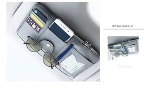 Detail of grey PU leather car visor organizer with card slots and sunglasses clip