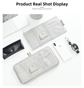 Detail of grey PU leather car sun visor organizer with card slots and mesh pockets